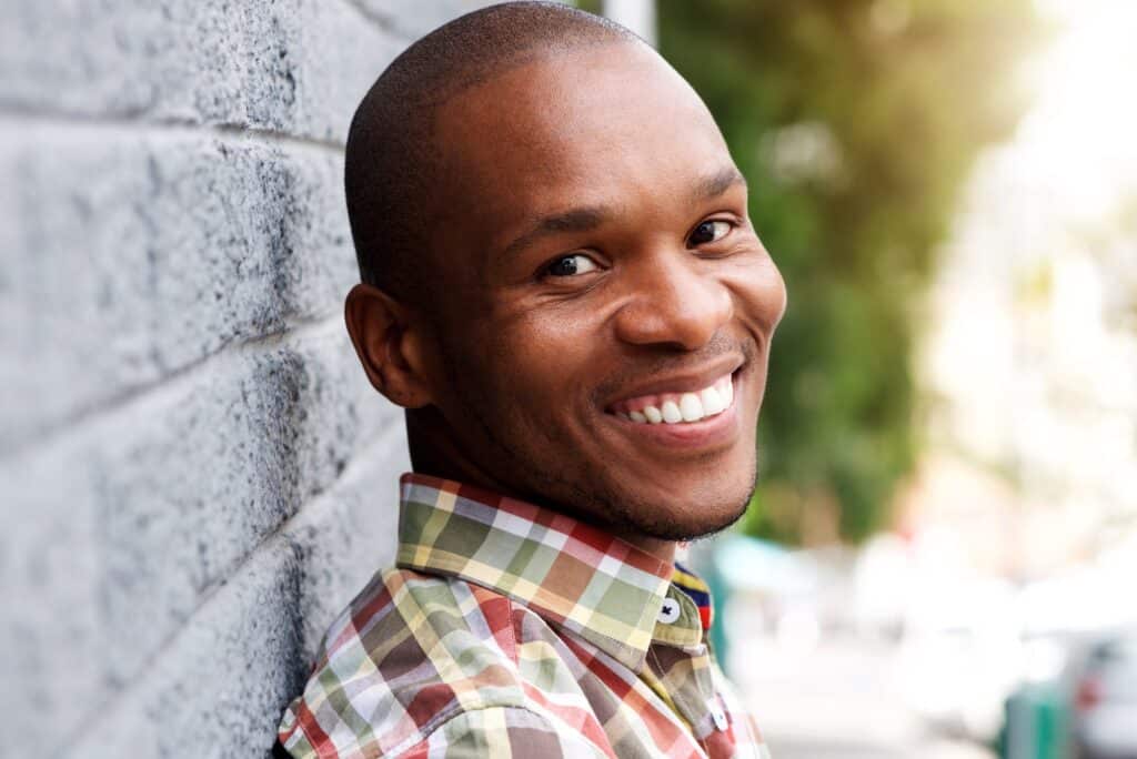 handsome young african man smiling